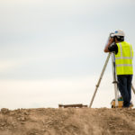Survey,Engineer,In,Construction,Site,Use,Theodolite,Mark,A,Concrete